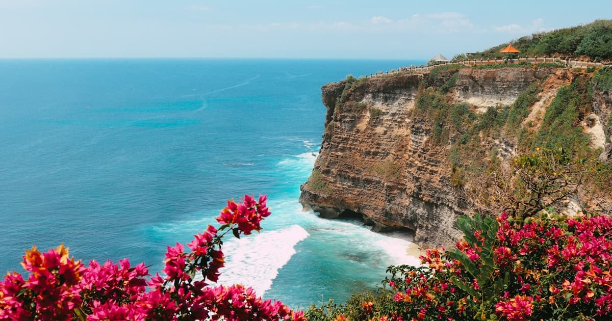 Bali โ Uluwatu temple perched on limestone cliffs above the Indian Ocean